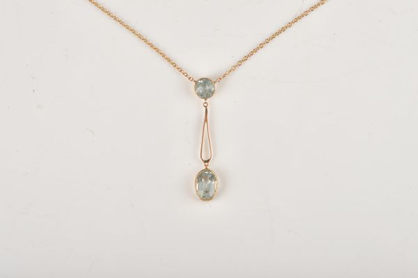 A GOLD AND AQUAMARINE TWO STONE PENDANT NECKLACE