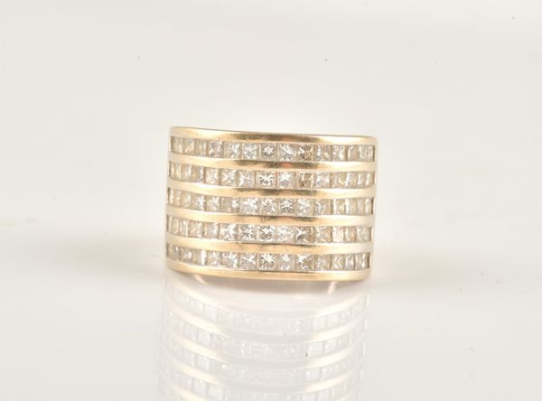 A WHITE GOLD AND DIAMOND SET HALF HOOP RING