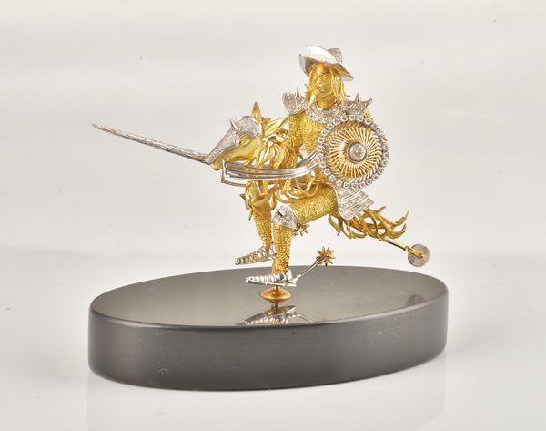AN 18CT TWO COLOUR GOLD AND DIAMOND SET BROOCH MODELLED AS DON QUIXOTE