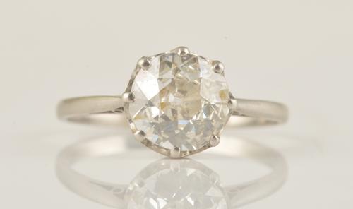 A PLATINUM AND DIAMOND SINGLE STONE RING
