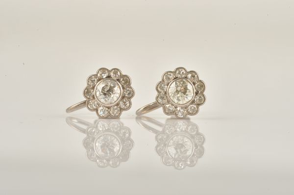 A PAIR OF WHITE GOLD AND DIAMOND CLUSTER EARRINGS (2)