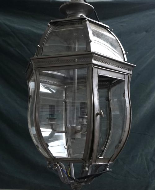 A HEXAGONAL GUN METAL COLOURED SHAPED LANTERN