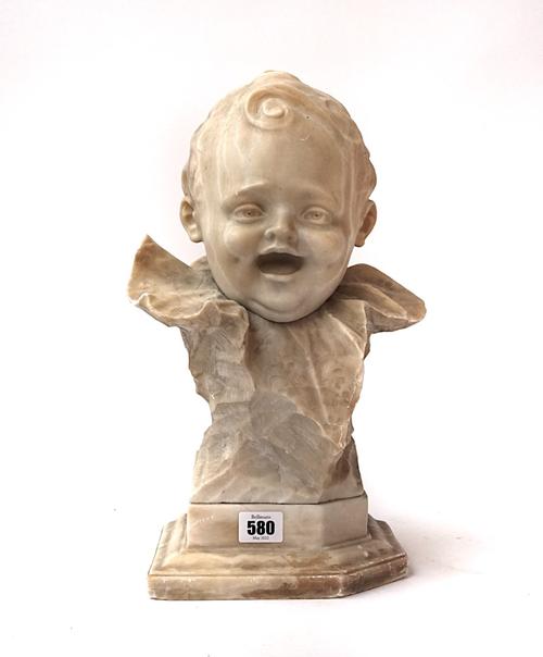 AN ITALIAN CARVED BUST OF A LAUGHING CHILD