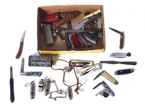 A COLLECTION OF 24 MOSTLY BRITISH POCKET KNIVES AND A GROUP OF TEN WHISTLES