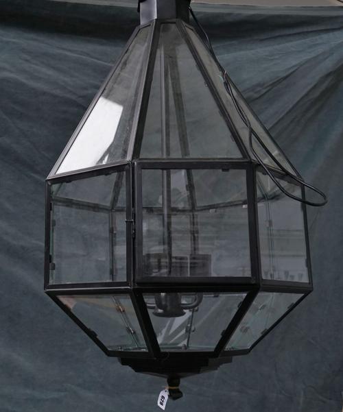 A BLACK METAL HEXAGONAL TAPERING HANGING LANTERN