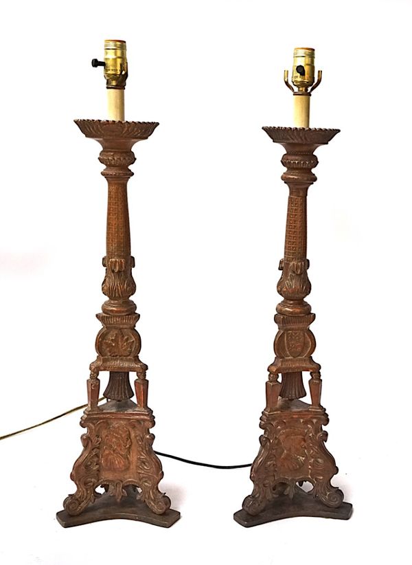 A PAIR OF FRENCH CARVED WALNUT LAMPS MODELLED AS ALTER PRICKET CANDLESTICKS (2)