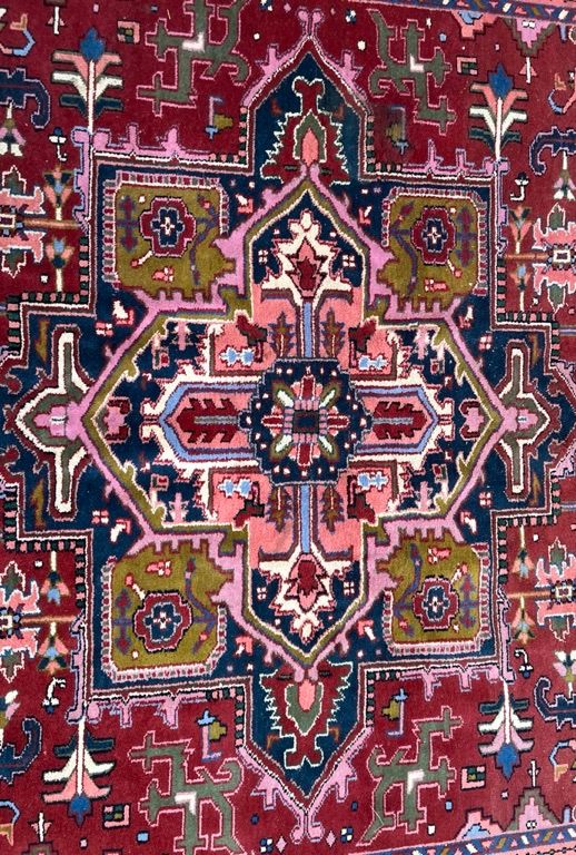 AN INDIAN CARPET OF HERIZ DESIGN