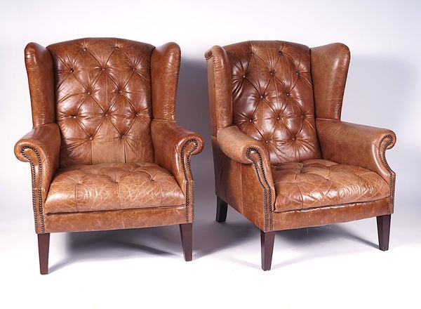 A PAIR OF STUDDED BROWN LEATHER UPHOLSTERED WINGBACK EASY ARMCHAIRS (2)