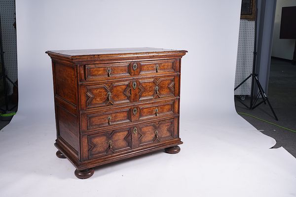 A CHARLES II FRUITWOOD GEOMETRIC MOULDED CHEST OF DRAWERS