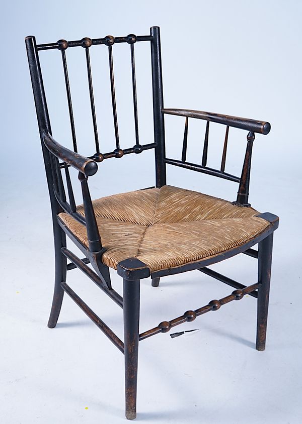 A WILLIAM MORRIS STYLE SUSSEX ARMCHAIR