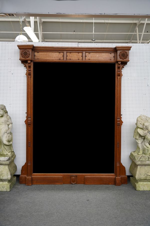 A LARGE VICTORIAN CARVED OAK GOTHIC REVIVAL OVER-MANTLE MIRROR