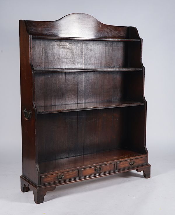 A GEORGE III STYLE MAHOGANY WATERFALL BOOKCASE