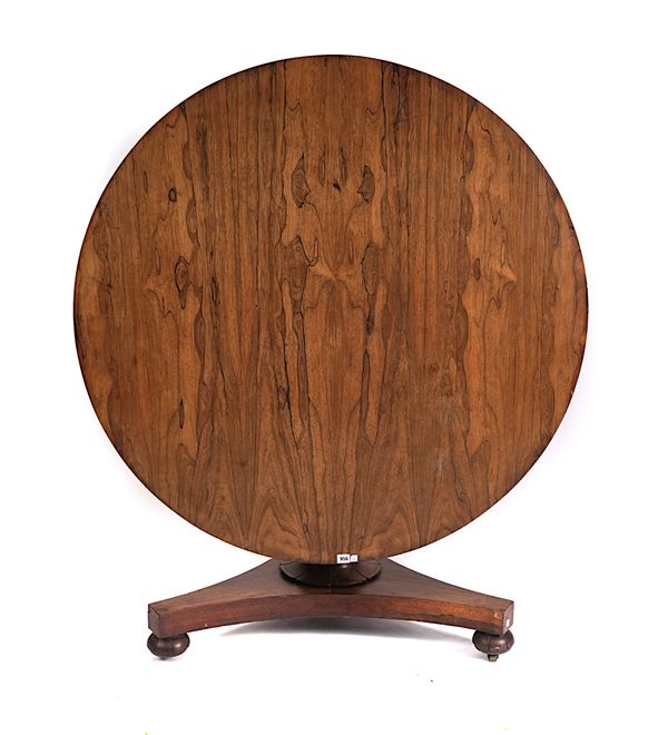 A REGENCY ROSEWOOD CIRCULAR SNAP TOP CENTRE TABLE