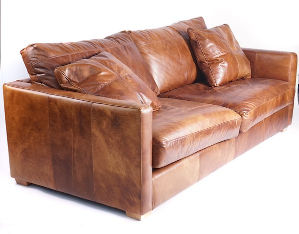 A MODERN TAN LEATHER THREE SEAT SOFA