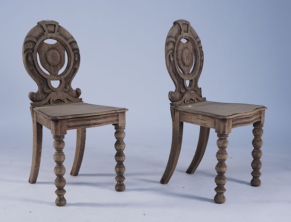 A PAIR OF 19TH CENTURY BLEACHED OAK SHIELD BACK HALL CHAIRS (2)