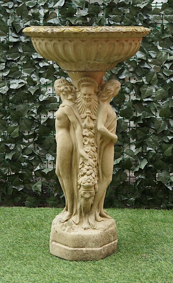 A RECONSTITUTED STONE BIRD BATH WITH ‘THE THREE GRACES’ COLUMN