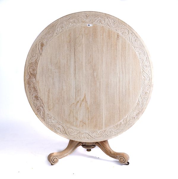 AN EARLY 19TH CENTURY BLEACHED OAK CIRCULAR TRIPOD CENTRE TABLE