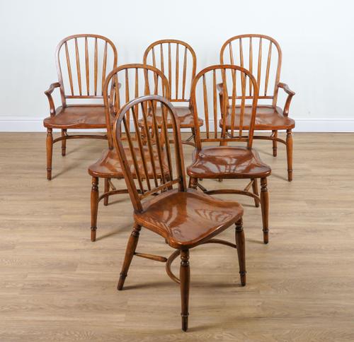 A SET OF SIX FRUITWOOD STICK BACK WINDSOR CHAIRS WITH CRINOLINE STRETCHERS (6)