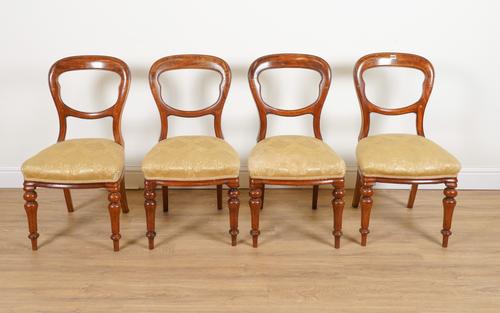 A SET OF FOUR VICTORIAN MAHOGANY BALLOON BACK DINING CHAIRS