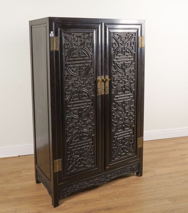 A LATE 19TH CENTURY CHINESE EXPORT EBONISED HARDWOOD HANGING CUPBOARD, WITH PAIR OF RAISED MOULDED PANEL DOORS