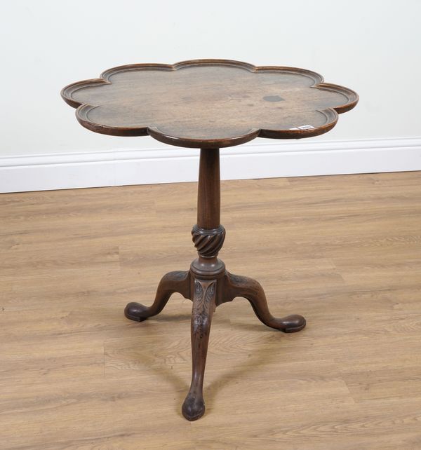 AN 18TH CENTURY MAHOGANY SCALLOP TOP TRIPOD OCCASIONAL TABLE