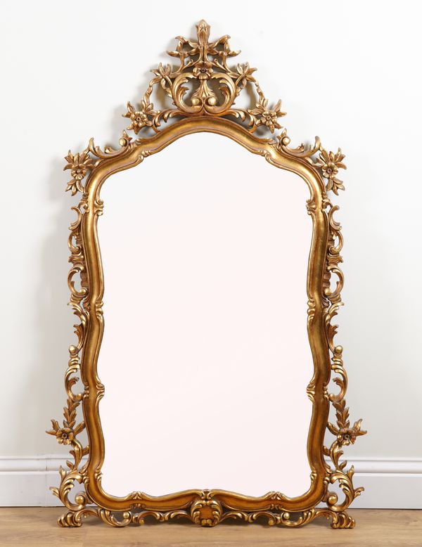 AN 18TH CENTURY STYLE GILT FRAMED SHAPED MIRROR