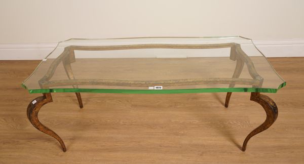 A GLASS SERPENTINE TOPPED COFFEE TABLE ON GILT BRONZE BASE