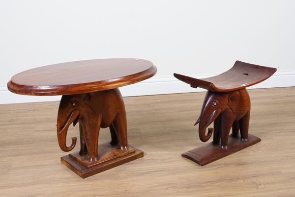 A HARDWOOD ASHANTI STOOL WITH ELEPHANT FIGURAL SUPPORT (2)