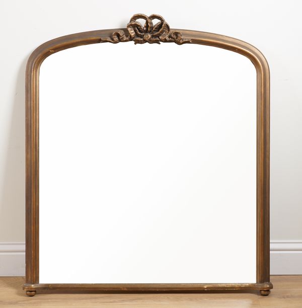 A GILT FRAMED ARCH TOP MIRROR