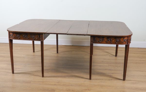 A GEORGE III MAHOGANY EXTENDING DINING TABLE