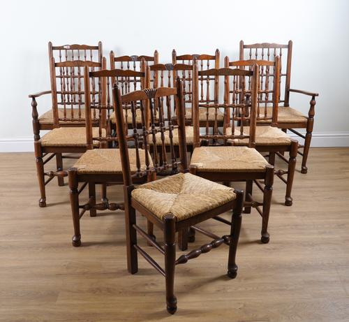 A MATCHED SET OF TEN ASH AND OAK BOBBIN BACK RUSH SEAT DINING CHAIRS (10)