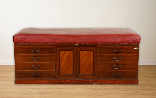 SPILLMAN AND CO; A CONVERTED ROUGE LEATHERETTE UPHOLSTERED DOCTORS EXAMINATION BENCH