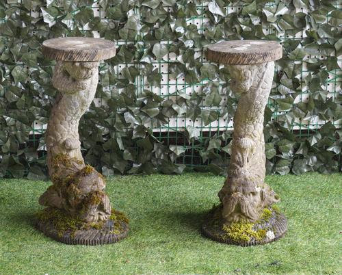 A PAIR OF RECONSTITUTED STONE FIGURES OF SEA SERPENTS (2)