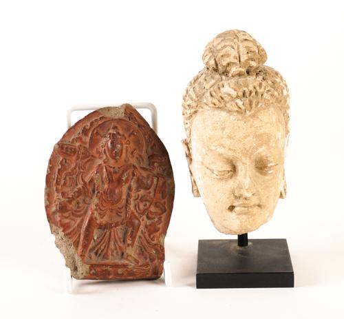 A GANDHARA STUCCO HEAD OF BUDDHA