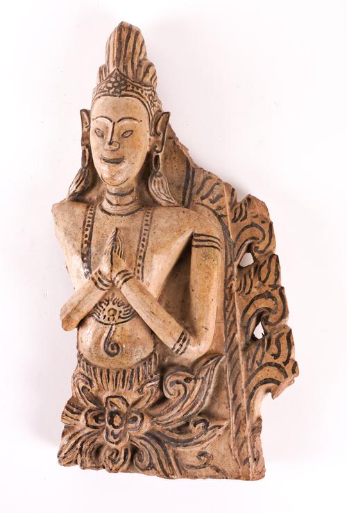 A GLAZED POTTERY ARCHITECTURAL FRAGMENT DEPICTING A MALE DEITY