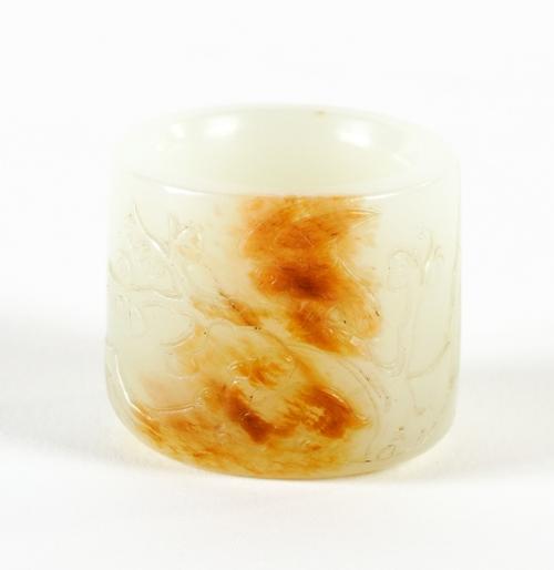 A GOOD CHINESE WHITE AND RUSSET  JADE ARCHER'S RING