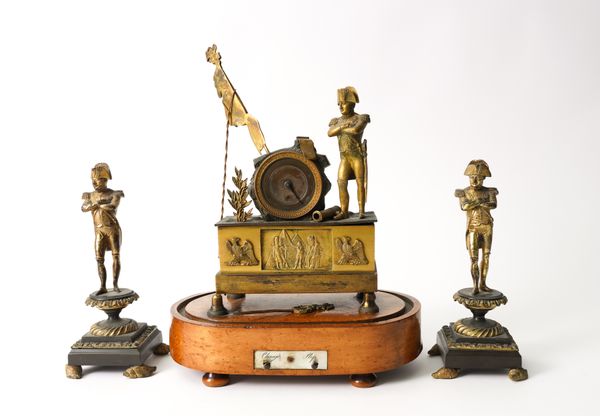 OF NAPOLEON BONAPARTE INTEREST: A FRENCH GILT-BRONZE MOUNTED TIMEPIECE AND TWO GILT-BRONZE FIGURES OF NAPOLEON (3)