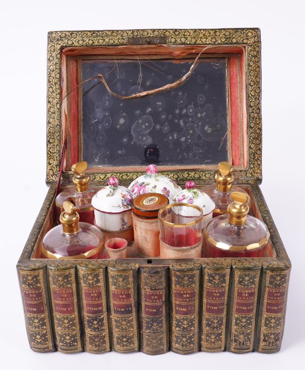 A FRENCH GILT-TOOLED LEATHER FAUX BOOK VANITY TANTALUS OR TOILET BOX