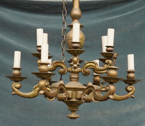 A LOUIS XIV STYLE TWO-TIER BRASS TWELVE LIGHT CHANDELIER