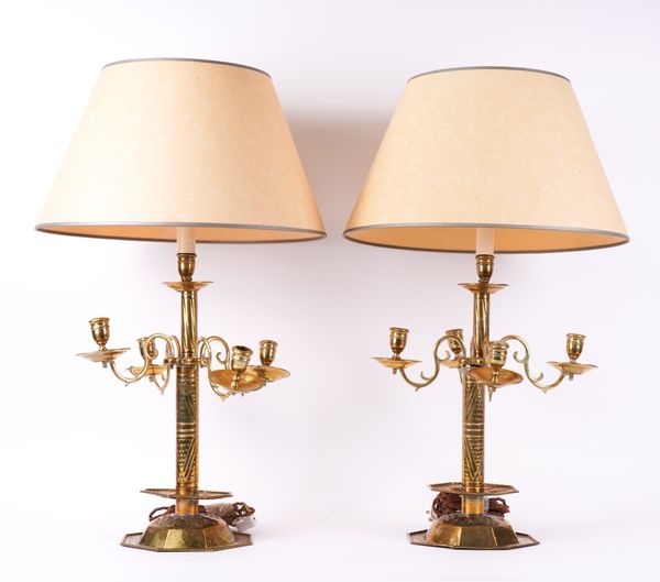 A PAIR OF NORTH EUROPEAN BRASS CONVERTED CANDELABRA (2)