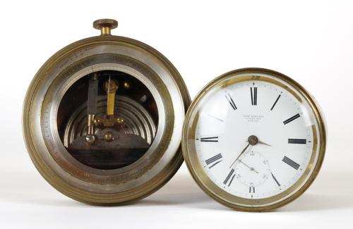 A BRASS CASED DRUM-SHAPED LEVER TIMEPIECE BY ROBERT ROSKELL, LIVERPOOL, NO. 53239 AND A BRASS CASED ANEROID ALTIMETER BY NIGER CO. (2)