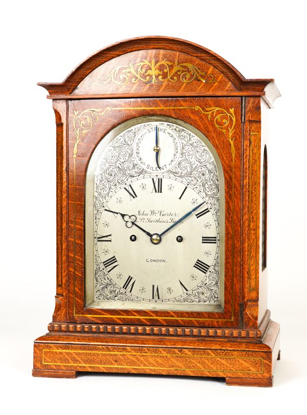 A VICTORIAN OAK AND BRASS INLAID STRIKING MANTEL CLOCK