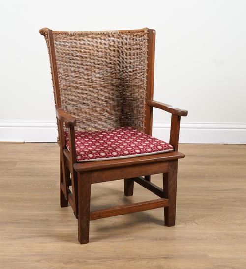 PROBABLY RETAILED BY LIBERTY; A WALNUT FRAMED ORKNEY CHAIR
