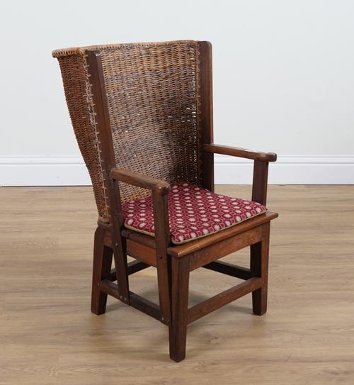 PROBABLY RETAILED BY LIBERTY; A WALNUT FRAMED ORKNEY CHAIR
