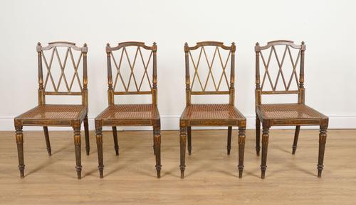A SET OF FOUR REGENCY PARCEL GILT GREEN POLYCHROME PAINTED LATTICE BACK SIDE CHAIRS