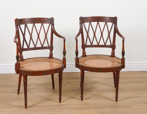 A PAIR OF POLYCHROME PAINTED SATINWOOD LATTICE BACK OPEN ARMCHAIRS ON TURNED SUPPORTS (2)