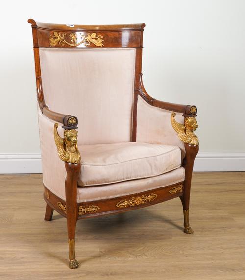 A FRENCH EMPIRE REVIVAL GILT METAL MOUNTED MAHOGANY HIGH TUB BACK ARMCHAIR