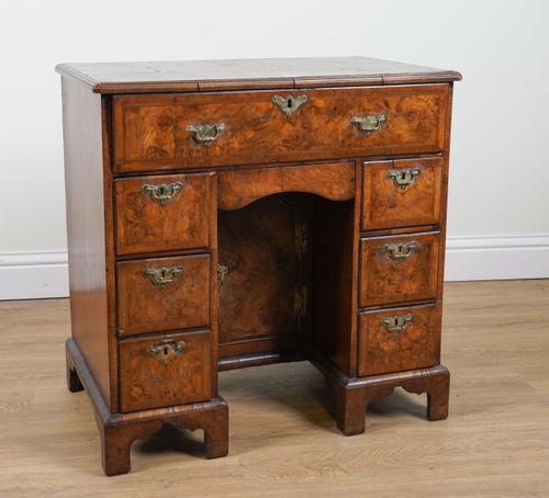 A GEORGE I FIGURED WALNUT SECRETAIRE KNEEHOLE WRITING DESK