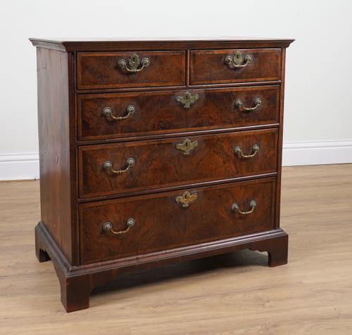 A GEORGE II BURR WALNUT CHEST OF FIVE DRAWERS