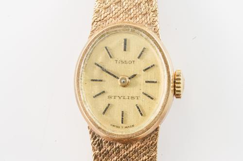 A TISSOT STYLIST 9CT GOLD BRACELET WRISTWATCH